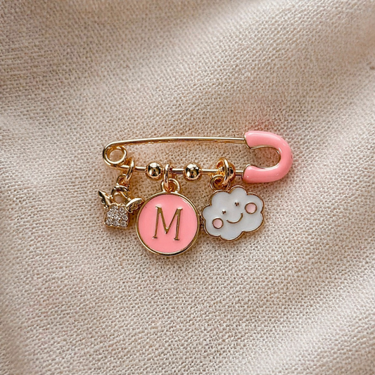 Personalised baby keepsake pin with pink initial charm and cloud symbol.